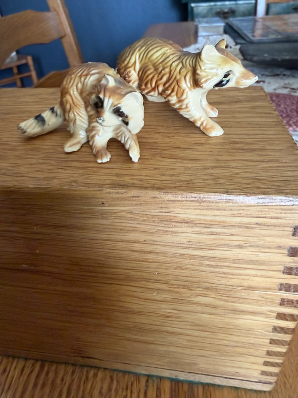 Mini pair of raccoon figurines